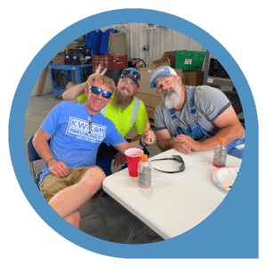 3 KWIKOM Field Techs Enjoying Office Grill Out